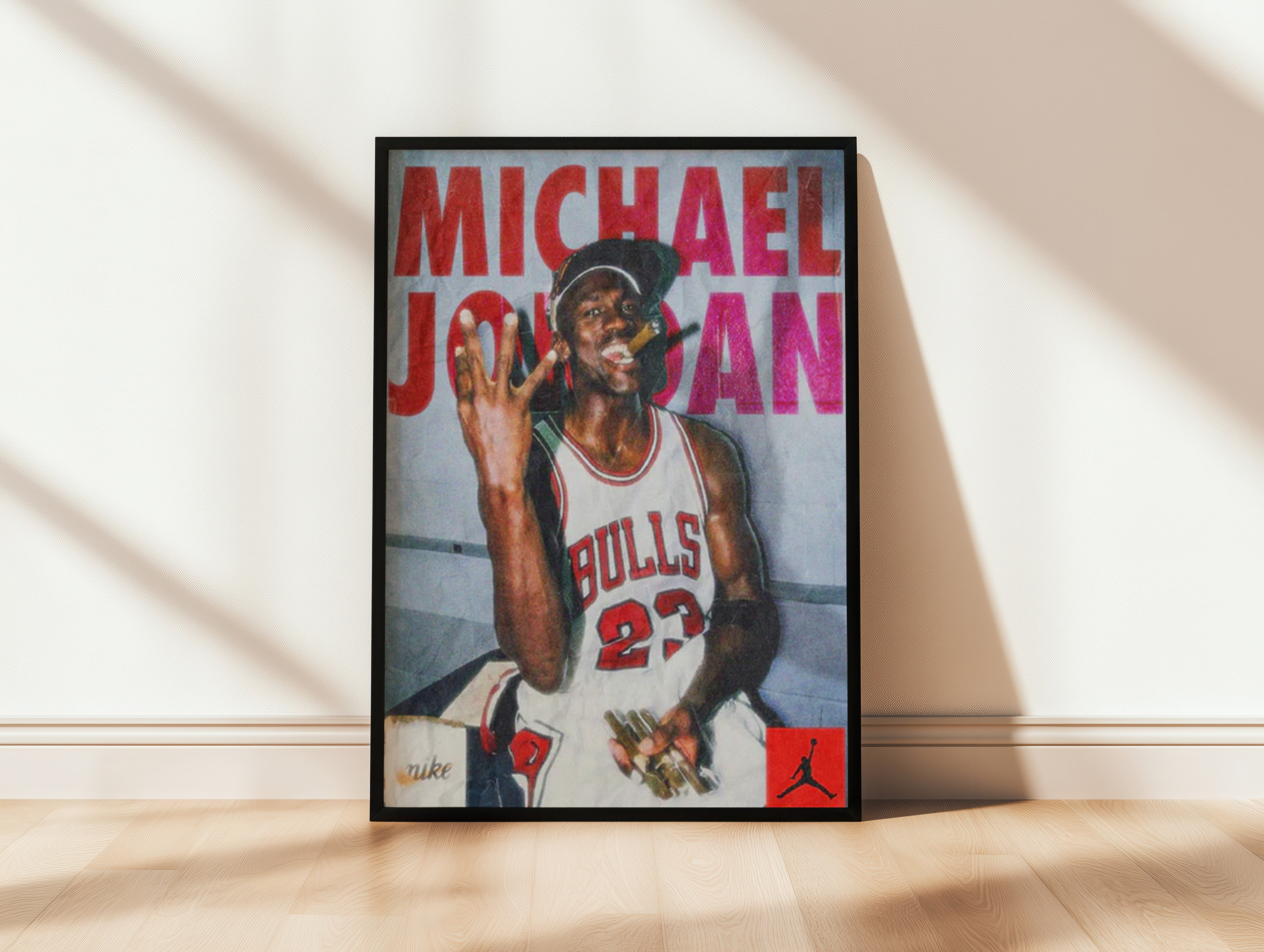 Framed poster of a basketball player in a Bulls jersey with 'Michael Jordan' text.